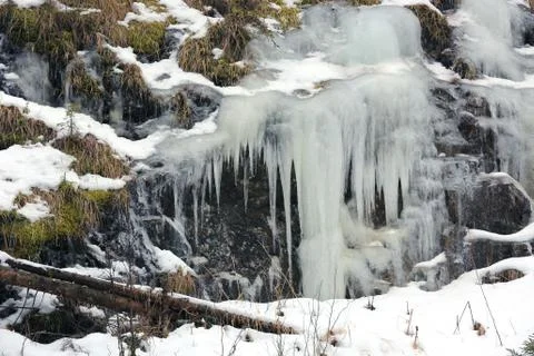 Frozen waterfall in forest Stock Photos