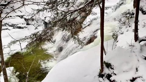 Frozen waterfall in the forest Stock Photos