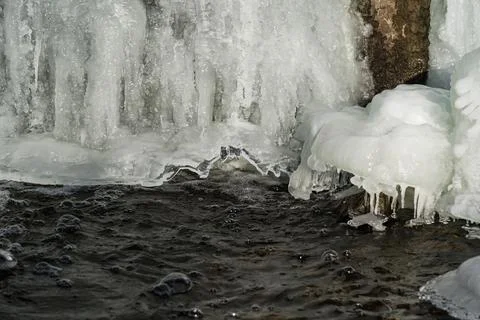 Frozen waterfall. Huge chunks of ice. Blocks of ice in the waterfall Stock Photos