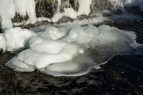 Frozen waterfall. Huge chunks of ice. Blocks of ice in the waterfall Stock Photos