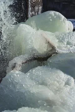 Frozen waterfall. Huge chunks of ice. Blocks of ice in the waterfall Stock Photos