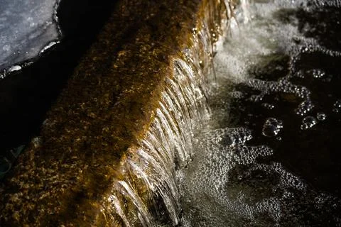 A frozen waterfall. Ice on the river Stock Photos