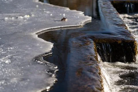 A frozen waterfall. Ice on the river Stock Photos