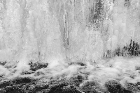 Frozen waterfall with ice in winter. Stock Photos
