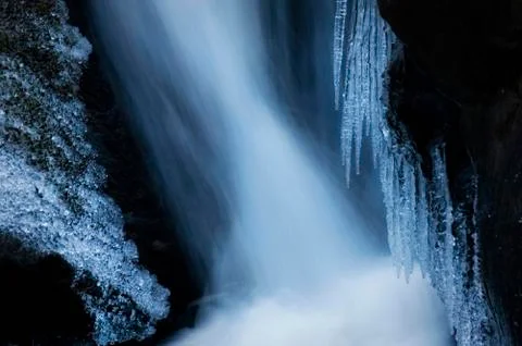 Frozen waterfall with icicles in winter Stock Photos