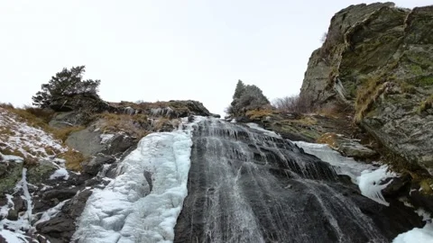 Frozen waterfall on the mountain. Low Angle View of ice waterfall Stock-Footage 224733803