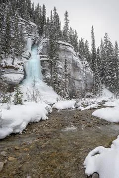 Frozen Waterfall on the Side of a Mountain Stock Photos