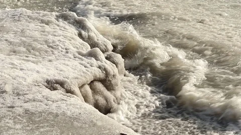 Frozen waves on the ice covered beach Stock Footage 102388400