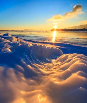 Frozen waves at sunset Stock Photos