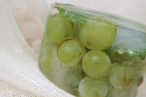 Frozen white grapes Stock Photos