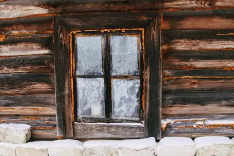 Frozen window pattern. Old rural bathhouse exterior. Stock Photos