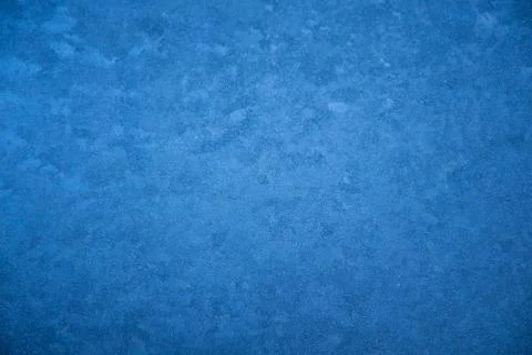 Frozen window patterns. Blue background. Abstraction. Frost Stock Photos