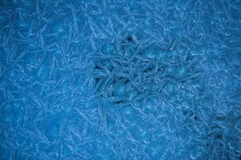 Frozen window patterns. Blue background. Abstraction. Frost Stock Photos