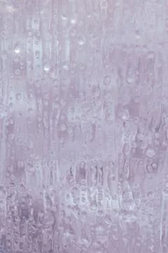 Frozen window in winter with drops and drips Stock Photos