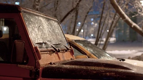 Frozen windshield of a car in the night winter city Stock Footage 123161879