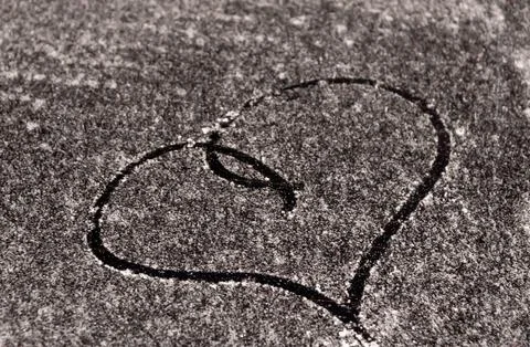 A frozen windshield with a heart. Stock Photos