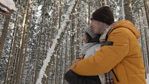 The frozen winter forest creates an atmosphere tranquility in which young couple Stock Footage 251441058