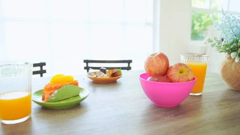 Fruit and bakery in breakfast for kid to go school, slow motion Stock Footage 108309699