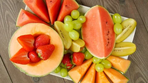 Fruit and berries in a plate. Video stock 297298944