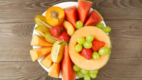 Fruit and berries in a plate. Stock Footage 302472781