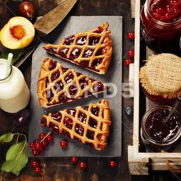 Fruit and berry jam and pieces of fruit tart Stock Photos