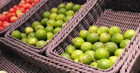 Fruit and vegetable basket at a local farmer's market with limes and tomatoes Stock Footage 226967151