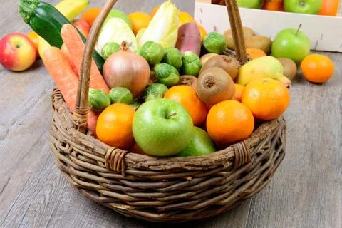 Fruit and vegetable basket Stock Photos