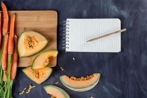 Fruit and vegetable with notebook Stock Photos