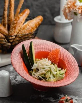 Fruit and vegetable salad on the table Stock Photos