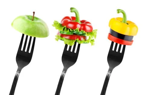 Fruit and vegetable slices on forkFruit and vegetable slices on fork Stock Photos