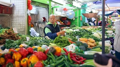 A fruit and vegetable stall in a Hong Kong street market Stock Footage 90968512
