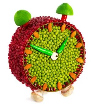 Fruit and vegetable volume clock  isolated on a white background Stock Photos