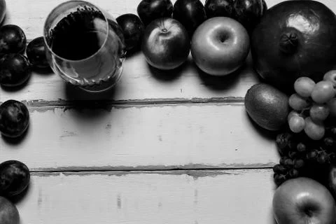 Fruit and wine on the table Stock Photos