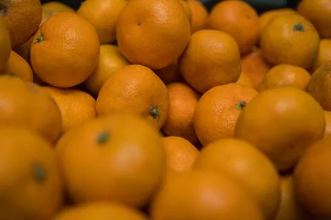 Fruit background. Small ripe orange tangerines. Vitamin complex Stock Photos