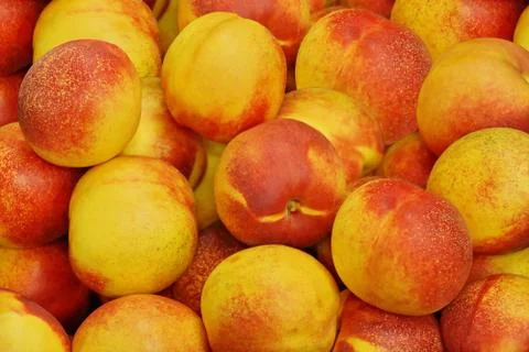Fruit background texture. nectarine peach yellow red ripe fruit. Fresh ripe f Stock Photos