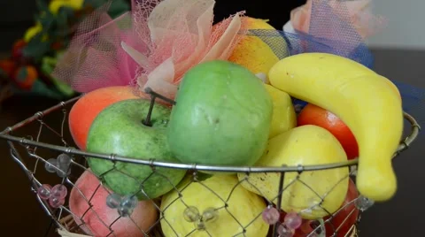 A fruit basket and sweets Stock Footage 62879189
