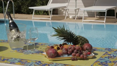 Fruit basket close up with background pool Stock Footage 88170832