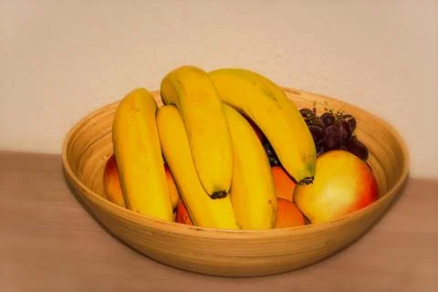 Fruit basket on a table Stock Photos