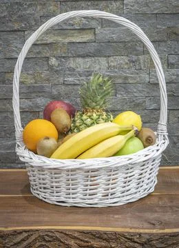 Fruit in a basket on the table Stock Photos
