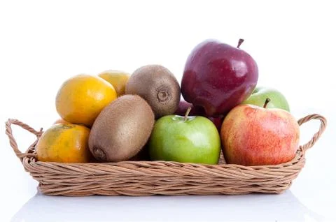 Fruit in basket on white background Stock Photos