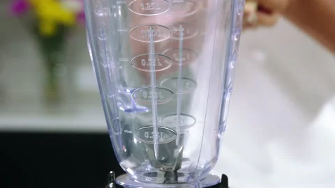 Fruit in a blender close-up Stock Footage 148990689