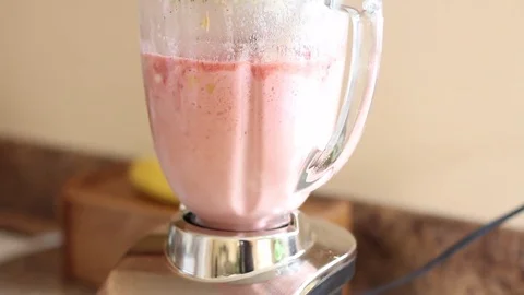 Fruit in a blender at gentle speed Stock Footage 83434771