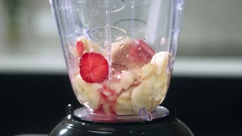 Fruit in a blender slow motion Stock Footage 148990880