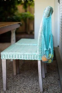 Fruit in blue string bag Stock Photos