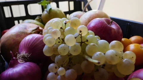 Fruit box full of apples, pomegranates, grapes. Natural fruits. Close up. 4k  Stock Footage 140110042