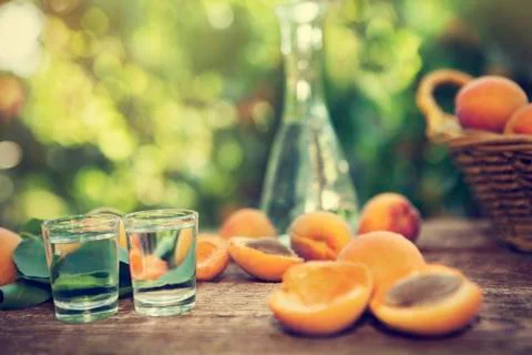 Fruit brandy with sliced apricots Stock Photos