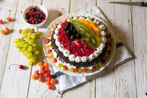Fruit cake and condiments Stock Photos