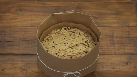 Fruit cake batter in a round tin ready to be baked. Stock Footage 195999032