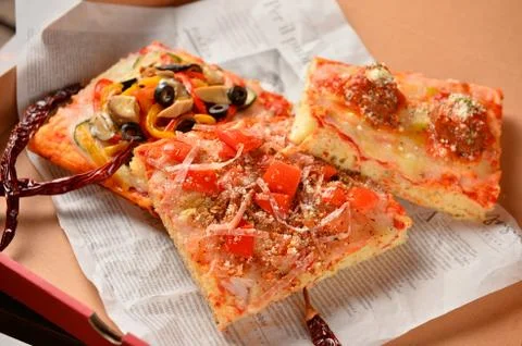 Fruit cake on newspaper on the table Stock Photos