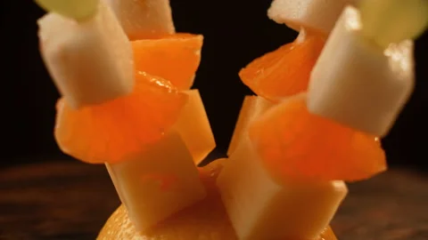 Fruit canapes, mini fruit canapes, pear, tangerine, grapes, cheese spinning Video stock 148621152